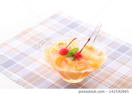 A refreshing fruit punch topped with fruit and cherries. A refreshing fruit punch topped with fruit and cherries. 142592665
