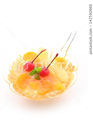 A refreshing fruit punch topped with fruit and cherries. A refreshing fruit punch topped with fruit and cherries. 142592668