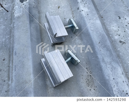 Installing two solar panels on roof Installing two solar panels on roof 142593298
