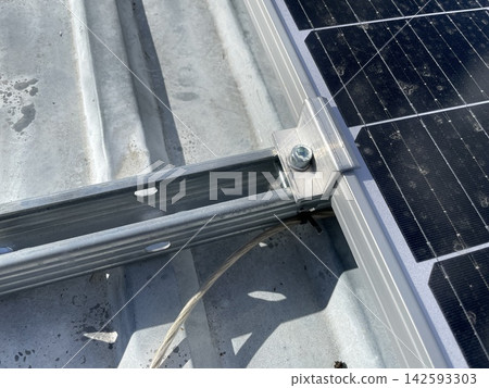 Installing two solar panels on roof Installing two solar panels on roof 142593303
