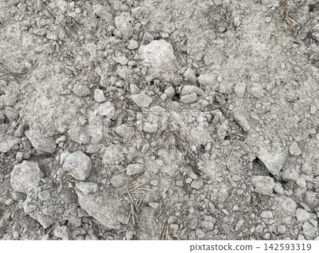 Plowed field dark soil ground texture Plowed field dark soil ground texture 142593319
