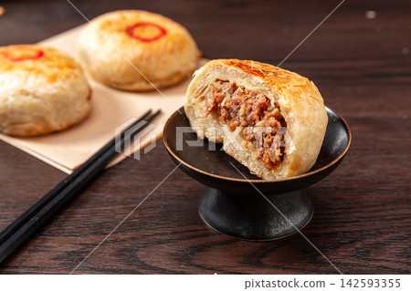 authentic Tianjin Shaobing, crispy baked sesame biscuits filled with seasoned beef. authentic Tianjin Shaobing, crispy baked sesame biscuits filled with seasoned beef. 142593355