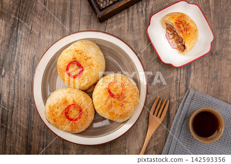 authentic Tianjin Shaobing, crispy baked sesame biscuits filled with seasoned beef. authentic Tianjin Shaobing, crispy baked sesame biscuits filled with seasoned beef. 142593356