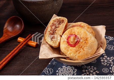 authentic Tianjin Shaobing, crispy baked sesame biscuits filled with seasoned beef. authentic Tianjin Shaobing, crispy baked sesame biscuits filled with seasoned beef. 142593357