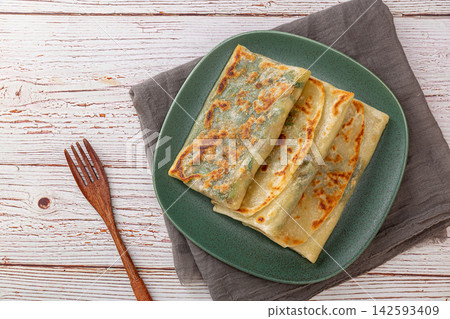 pan-fried Chinese chive and egg pockets, Sanxian vegetable turnover pancake served with chili dipping sauce. pan-fried Chinese chive and egg pockets, Sanxian vegetable turnover pancake served with chili dipping sauce. 142593409