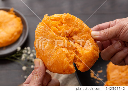 traditional Chinese crispy pumpkin flatbread shaobing pastries on bamboo mat traditional Chinese crispy pumpkin flatbread shaobing pastries on bamboo mat 142593542