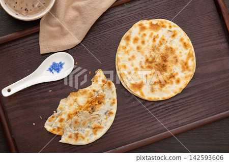 authentic Chinese Meigancai Kourou Bing, baked crispy pancake with minced pork filling. authentic Chinese Meigancai Kourou Bing, baked crispy pancake with minced pork filling. 142593606