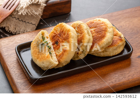 pan-fried Chinese beef meat pie, traditional savory minced beef pastry pancake on a plate pan-fried Chinese beef meat pie, traditional savory minced beef pastry pancake on a plate 142593612