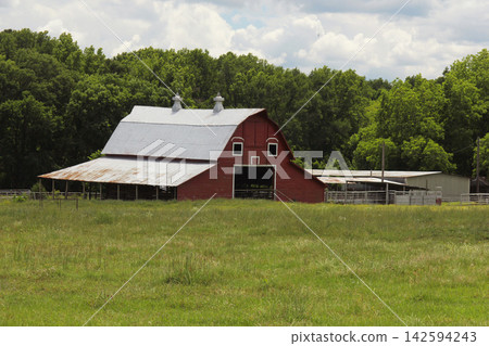 Red Barn located on Farm in East Texas with Blue Sky, Overton TX Red Barn located on Farm in East Texas with Blue Sky, Overton TX 142594243