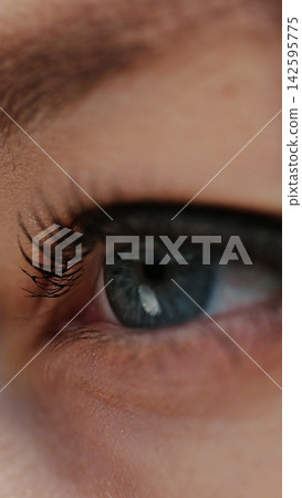 Vertical video. Close up of woman face at sunset, blue eyes, portrait, outdoor relax sunlight. Girl opening her blue eyes. Vertical video. Close up of woman face at sunset, blue eyes, portrait, outdoor relax sunlight. Girl opening her blue eyes. 142595775