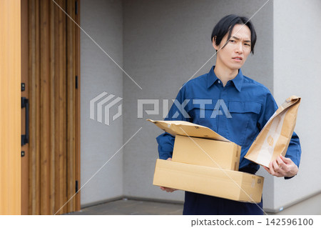 Male driver delivering luggage Male driver delivering luggage 142596100