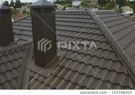 Corrugated metal roof and metal roofing. Modern roof made of metal. Corrugated metal roof and metal roofing. Modern roof made of metal. 142596404
