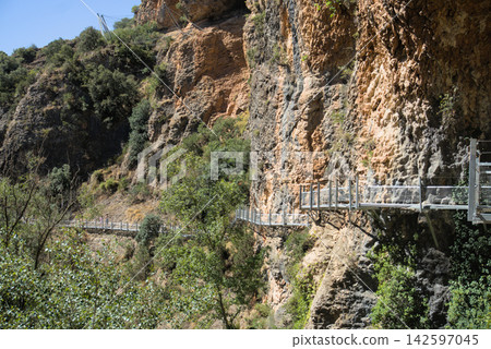 Tiered metal walkways on a cliff at the Pasarelas del Vero Alquezar Spain Tiered metal walkways on a cliff at the Pasarelas del Vero Alquezar Spain 142597045
