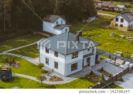 Corrugated metal roof and metal roofing. Modern roof made of metal. Corrugated metal roof and metal roofing. Modern roof made of metal. 142598247