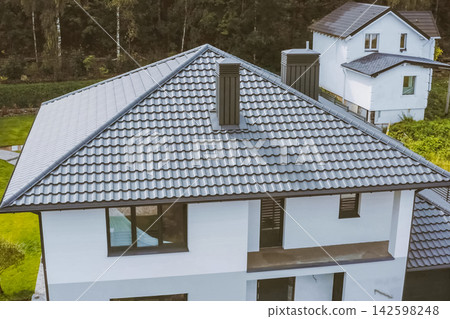 Corrugated metal roof and metal roofing. Modern roof made of metal. Corrugated metal roof and metal roofing. Modern roof made of metal. 142598248