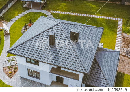 Corrugated metal roof and metal roofing. Modern roof made of metal. Corrugated metal roof and metal roofing. Modern roof made of metal. 142598249