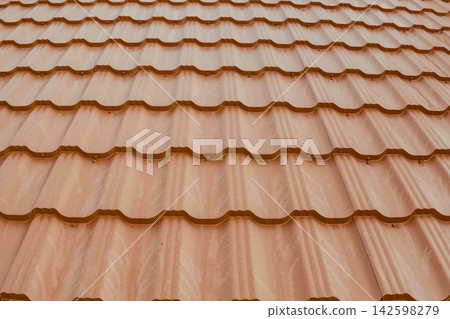 Corrugated metal roof and metal roofing. Modern roof made of metal. Corrugated metal roof and metal roofing. Modern roof made of metal. 142598279