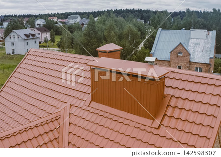 Corrugated metal roof and metal roofing. Modern roof made of metal. Corrugated metal roof and metal roofing. Modern roof made of metal. 142598307