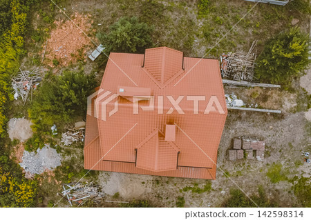 Corrugated metal roof and metal roofing. Modern roof made of metal. Corrugated metal roof and metal roofing. Modern roof made of metal. 142598314