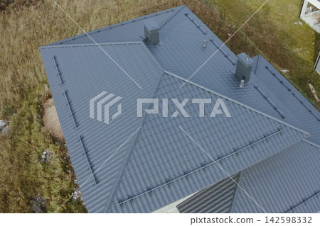 Corrugated metal roof and metal roofing. Modern roof made of metal. 142598332