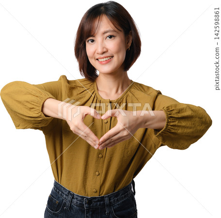 Asian woman forming heart with hands and smiling in mustard blouse on transparent background for affection and kindness Asian woman forming heart with hands and smiling in mustard blouse on transparent background for affection and kindness 142598861