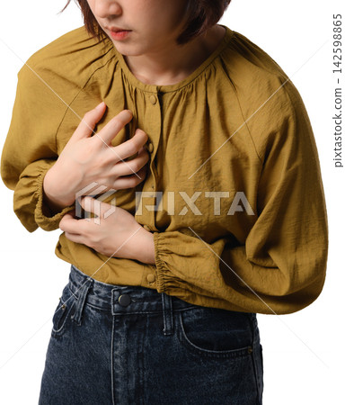 Asian woman clutching stomach with abdominal pain and discomfort in mustard blouse against transparent background Asian woman clutching stomach with abdominal pain and discomfort in mustard blouse against transparent background 142598865