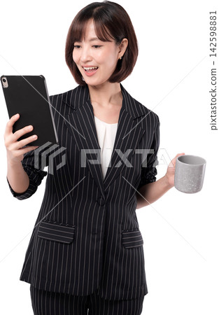 Asian woman smiling while holding tablet and ceramic cup in modern business portrait with transparent background Asian woman smiling while holding tablet and ceramic cup in modern business portrait with transparent background 142598881