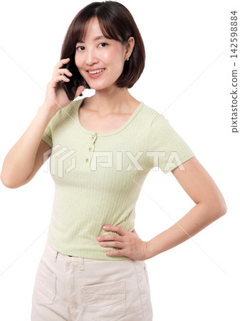Asian woman smiling while talking on mobile phone with confident friendly expression Asian woman smiling while talking on mobile phone with confident friendly expression 142598884