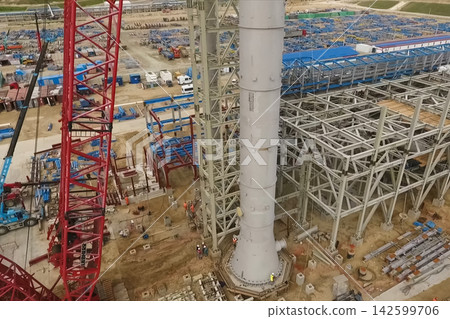 Installation of distillation column at an oil refinery. Installation of distillation column at an oil refinery. 142599706