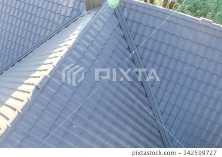 Corrugated metal roof and metal roofing. Modern roof made of metal. Corrugated metal roof and metal roofing. Modern roof made of metal. 142599727