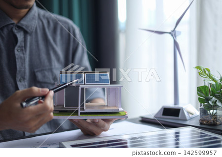 Architect Working on renewable Energy Housing Project. 142599957