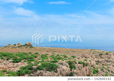 Panoramic view of an idyllic meadow with Mount Etna volcano in the background Panoramic view of an idyllic meadow with Mount Etna volcano in the background 142600142