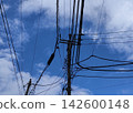 Power lines stretching across the blue sky 142600148