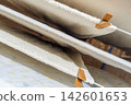 White Towels Air Drying Outdoors on a Clothesline 142601653