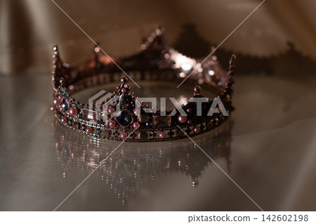 Vintage Jeweled Crown with Pink Pearls and Dark Gemstones, Elegant Royal Luxury. Vintage Jeweled Crown with Pink Pearls and Dark Gemstones, Elegant Royal Luxury. 142602198