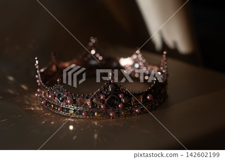Vintage Jeweled Crown with Pink Pearls and Dark Gemstones, Elegant Royal Luxury. Vintage Jeweled Crown with Pink Pearls and Dark Gemstones, Elegant Royal Luxury. 142602199