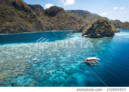 Boats in the coves and reefs of Coron Island Boats in the coves and reefs of Coron Island 142602653