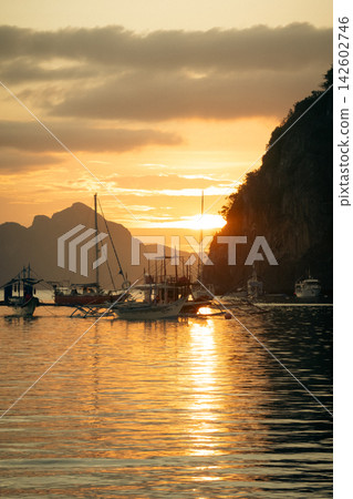 Sunset and sailing ships in El Nido Bay Sunset and sailing ships in El Nido Bay 142602746
