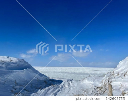 A winter blue sky, a vast expanse of silvery snow, and drift ice. A winter blue sky, a vast expanse of silvery snow, and drift ice. 142602755