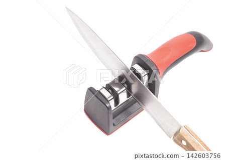 Manual new knife sharpener and knife isolated on white. Manual new knife sharpener and knife isolated on white. 142603756