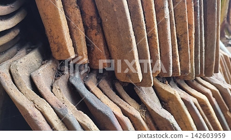 Stack of Old Terracotta Roof Tiles for Building and Renovation Stack of Old Terracotta Roof Tiles for Building and Renovation 142603959