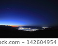 Mount Fuji and the morning star seen across Lake Suwa at twilight. 142604954