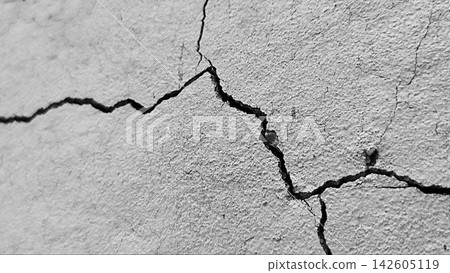Monochrome Close-Up of Fine Cracks on Concrete Wall Monochrome Close-Up of Fine Cracks on Concrete Wall 142605119