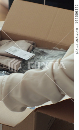 Vertical video. Customer Unpacking Online Shop Purchase: Happy Buyer Opening Delivery Package. Vertical video. Customer Unpacking Online Shop Purchase: Happy Buyer Opening Delivery Package. 142606332