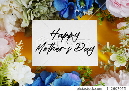 Happy Mother's Day text written on paper card with flowers decoration Happy Mother's Day text written on paper card with flowers decoration 142607055