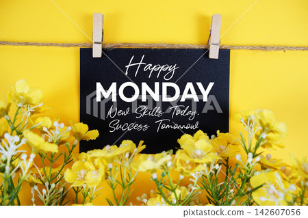 Happy Monday and motivational quotes written on paper card with flowers decoration Happy Monday and motivational quotes written on paper card with flowers decoration 142607056