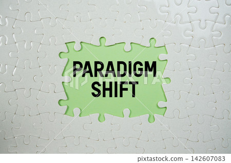Jigsaw puzzle with a missing piece with "Paradigm Shift" on green background Jigsaw puzzle with a missing piece with "Paradigm Shift" on green background 142607083