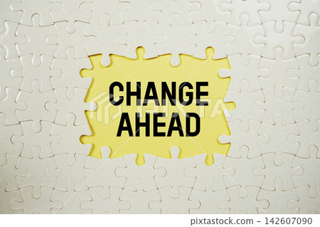 Jigsaw puzzle with a missing piece with "Change Ahead" on yellow background Jigsaw puzzle with a missing piece with "Change Ahead" on yellow background 142607090
