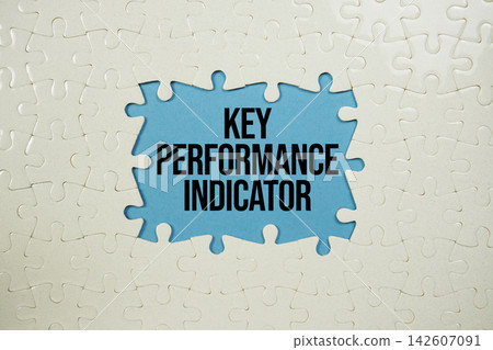 Jigsaw puzzle with a missing piece with "KPI Key Performance Indicator" on blue background Jigsaw puzzle with a missing piece with "KPI Key Performance Indicator" on blue background 142607091