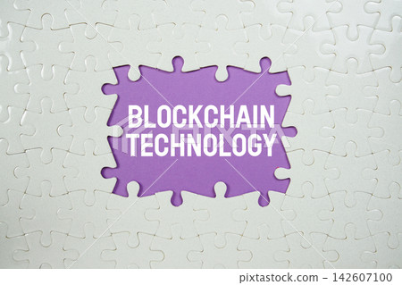Jigsaw puzzle with a missing piece with "Blockchain Technology" on purple background Jigsaw puzzle with a missing piece with "Blockchain Technology" on purple background 142607100